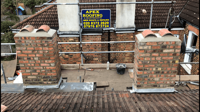 Traditional chimney restoration with multiple new pots