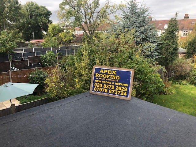 Flat roof repair with clean edges and drainage falls