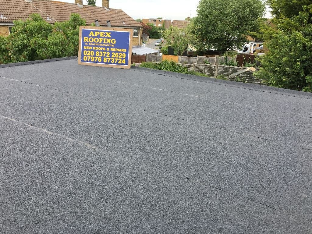 Flat roof installation in a residential back-garden setting