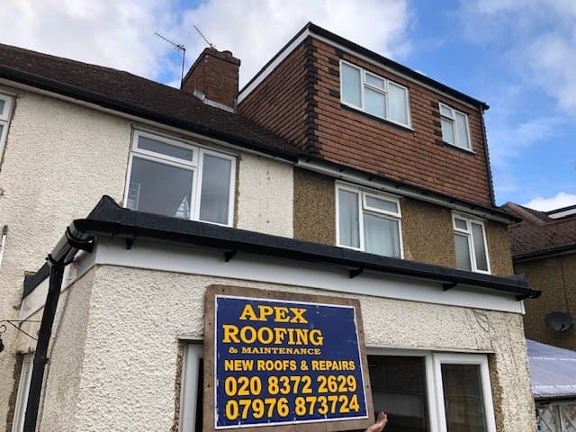House exterior showing completed roofing work